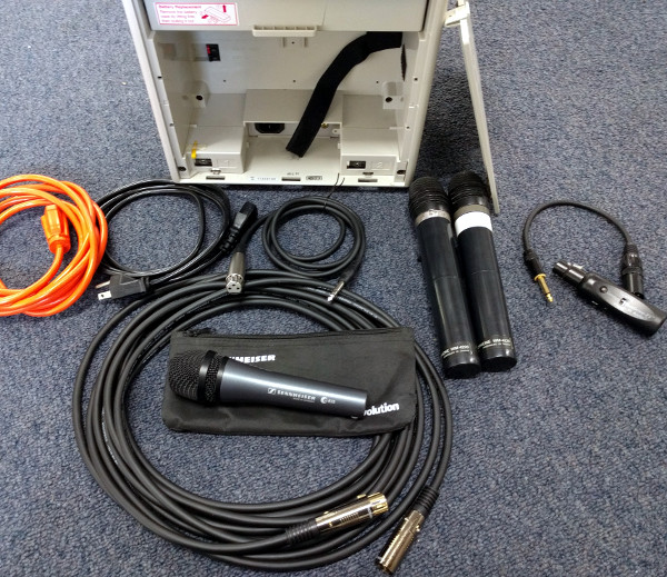 A picture of the back of the sound system with some accessories displayed